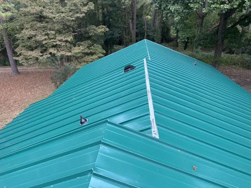After: finished green ribbed metal roof installed by Lopez Brothers Roofing in Wayne County, NC