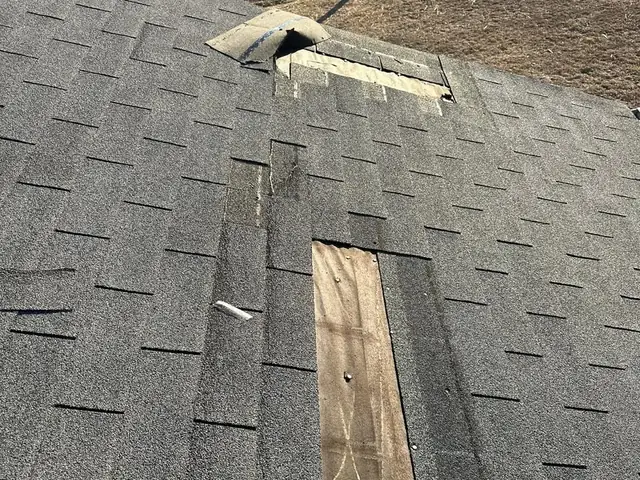 Ridge vent and decking exposed during a shingle repair